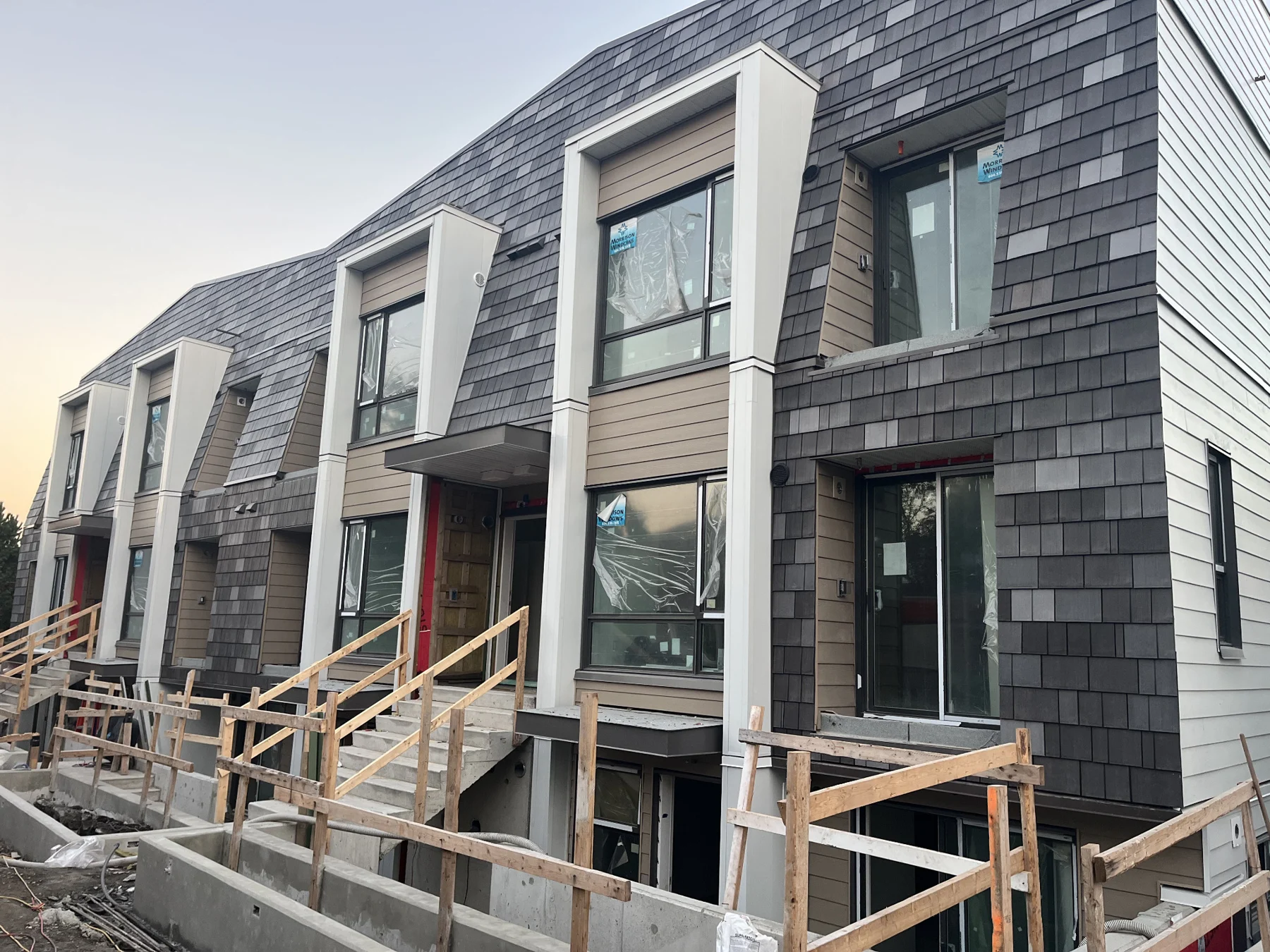 Townhouse exterior showing siding, windows and building-envelope details
